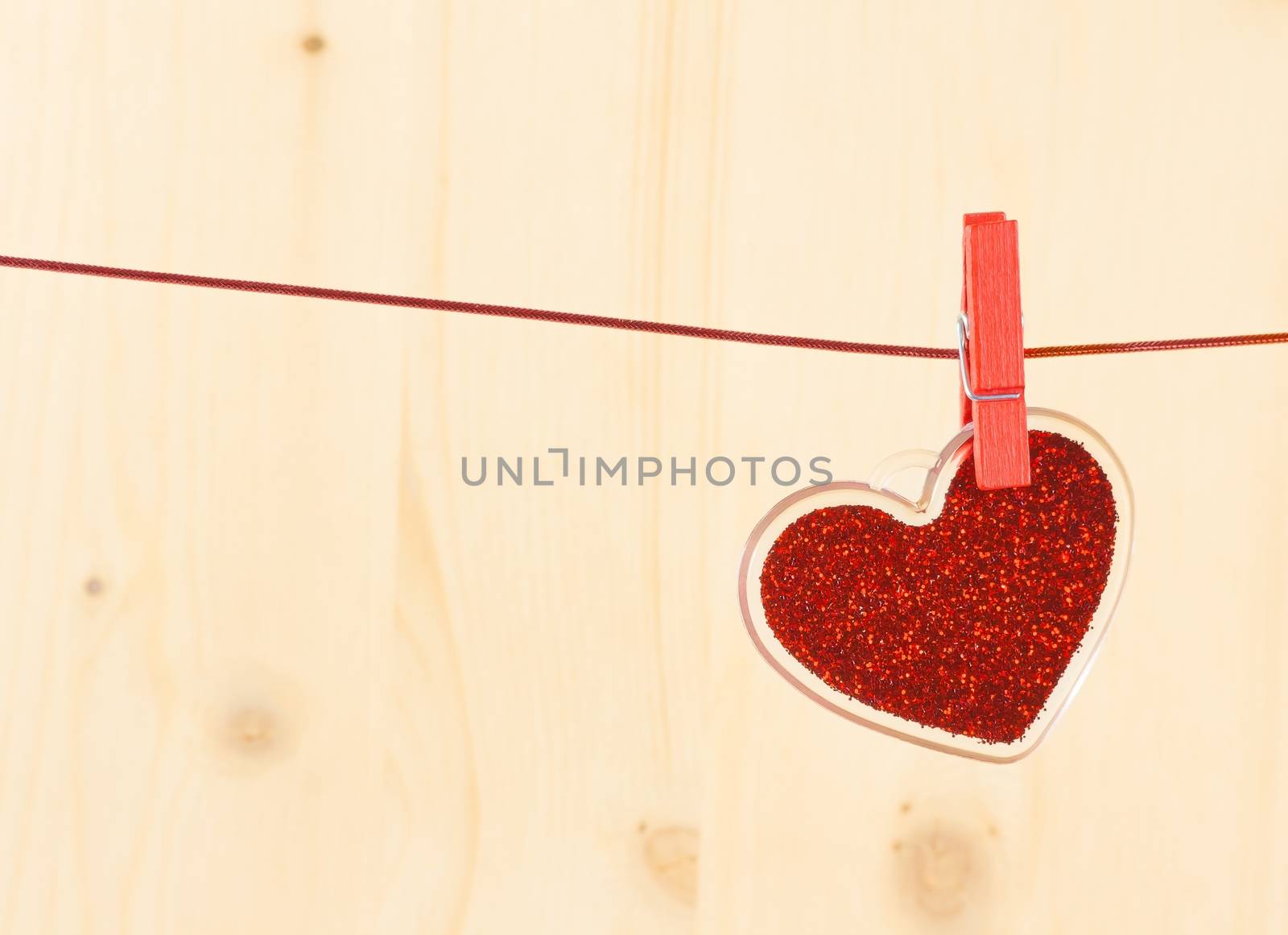 valentine day series, decorative red heart hanging on wood background by donfiore