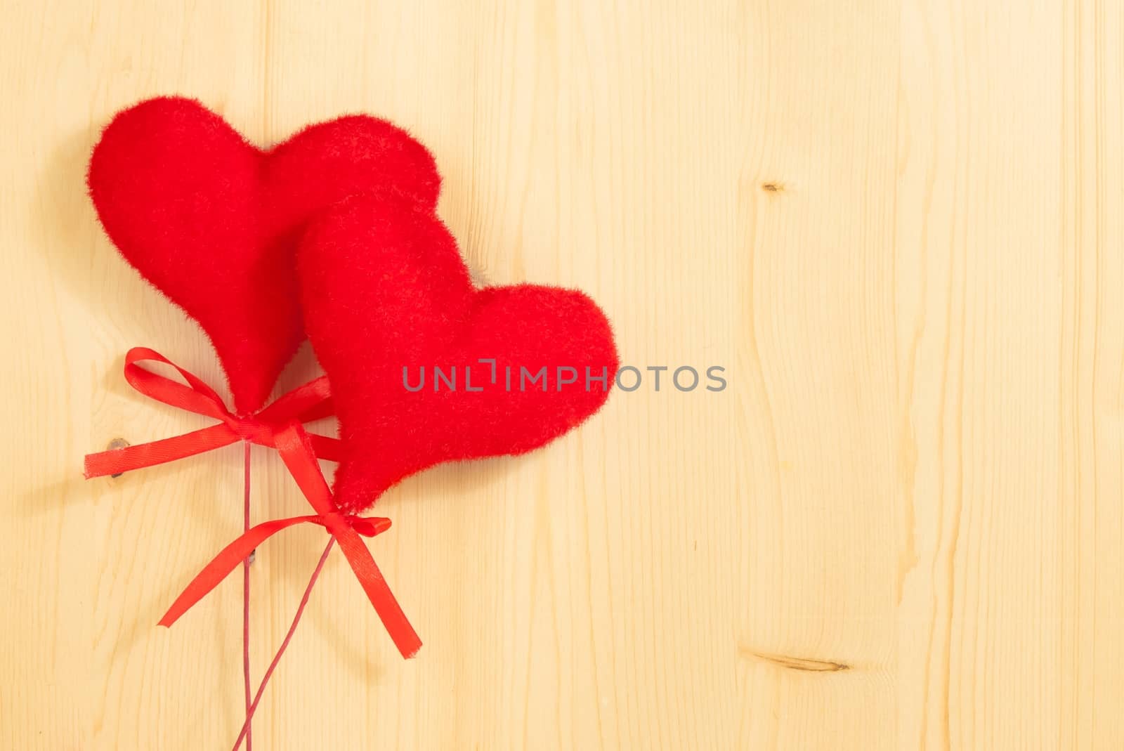 valentine day series, decorative red hearts hanging on wood background with space for text