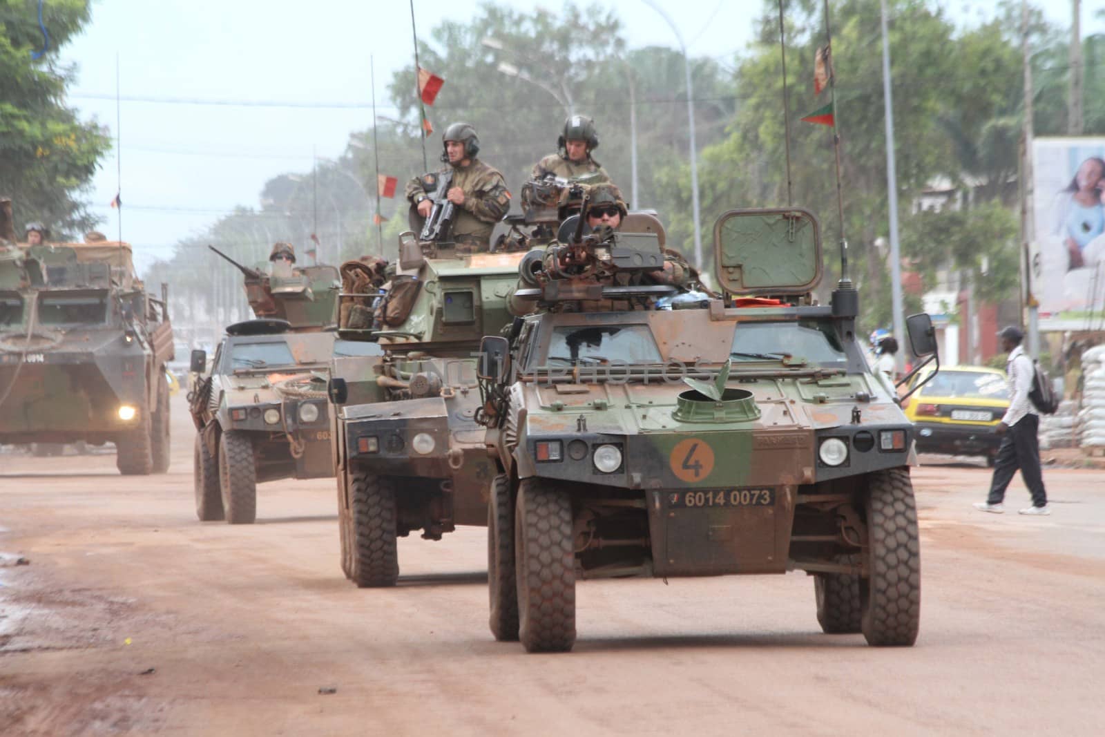 CENTRAL AFRICAN REPUBLIC, Bangui : Vehicles of the French Sangaris armed force passe on a street in Bangui, as it patrols in the city, on October 8, 2015. The Central African Republic descended into bloodshed more than two years ago after long time president Francois Bozize, a Christian, was ousted by Seleka rebels, triggering the worst crisis since independence in 1960. On September 29, 2015, Bangui returned to only relative calm after three days of inter-community violence which left at least 40 dead and 100 injured according to the UN Refugee Agency UNHCR. Some 27,000 inhabitants of Bangui have also fled to displaced people's camps. 
