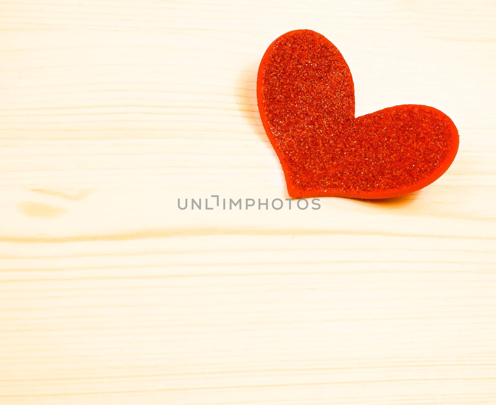 one decorative red heart on wood background with space for text, concept of valentine day