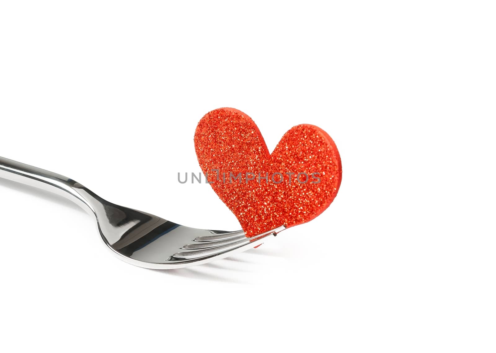 decorative red heart near a fork on white background with space for text, concept valentine day dinner 