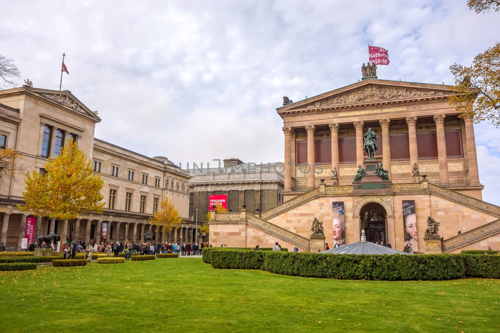 Berlin, Germany - October 26, 2013: Exterior view of Alte Nationalgalerie (Old National Gallery) on the Museumsinsel in Berlin-Mitte. Neues Museum (New Museum) on the left, Pergamon museum in the background.