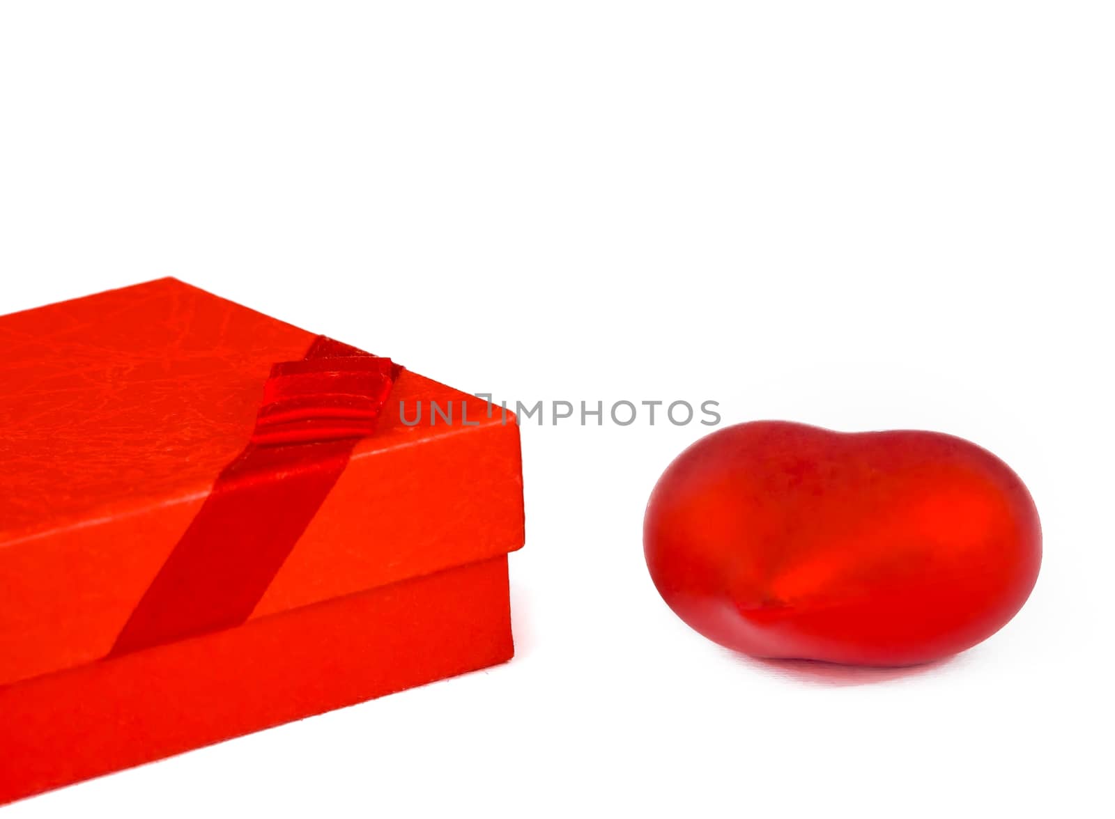 two decorative red hearts and a gift on white background, concept of valentine day by donfiore