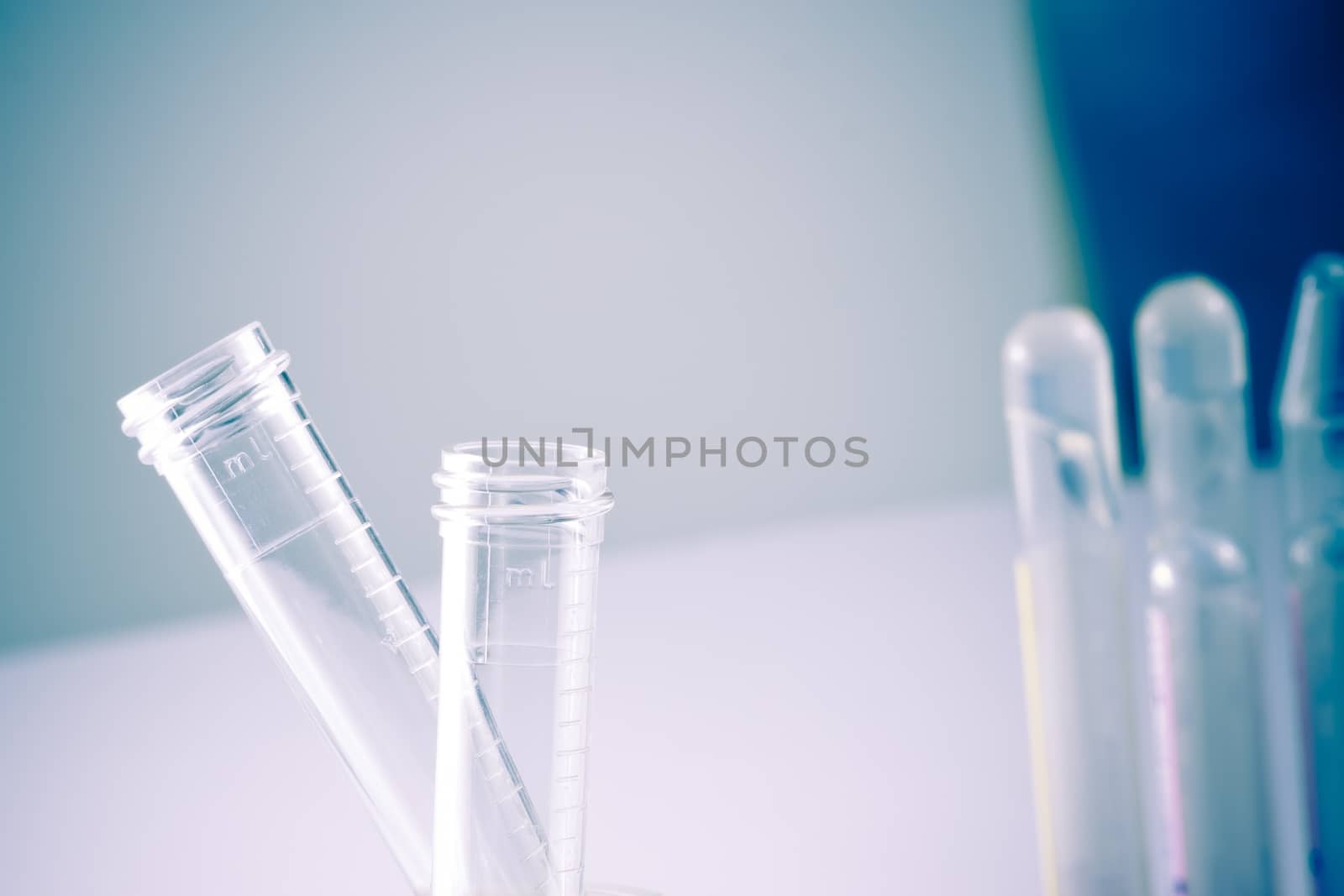 detail of test tubes in hospital laboratory on table with space for text