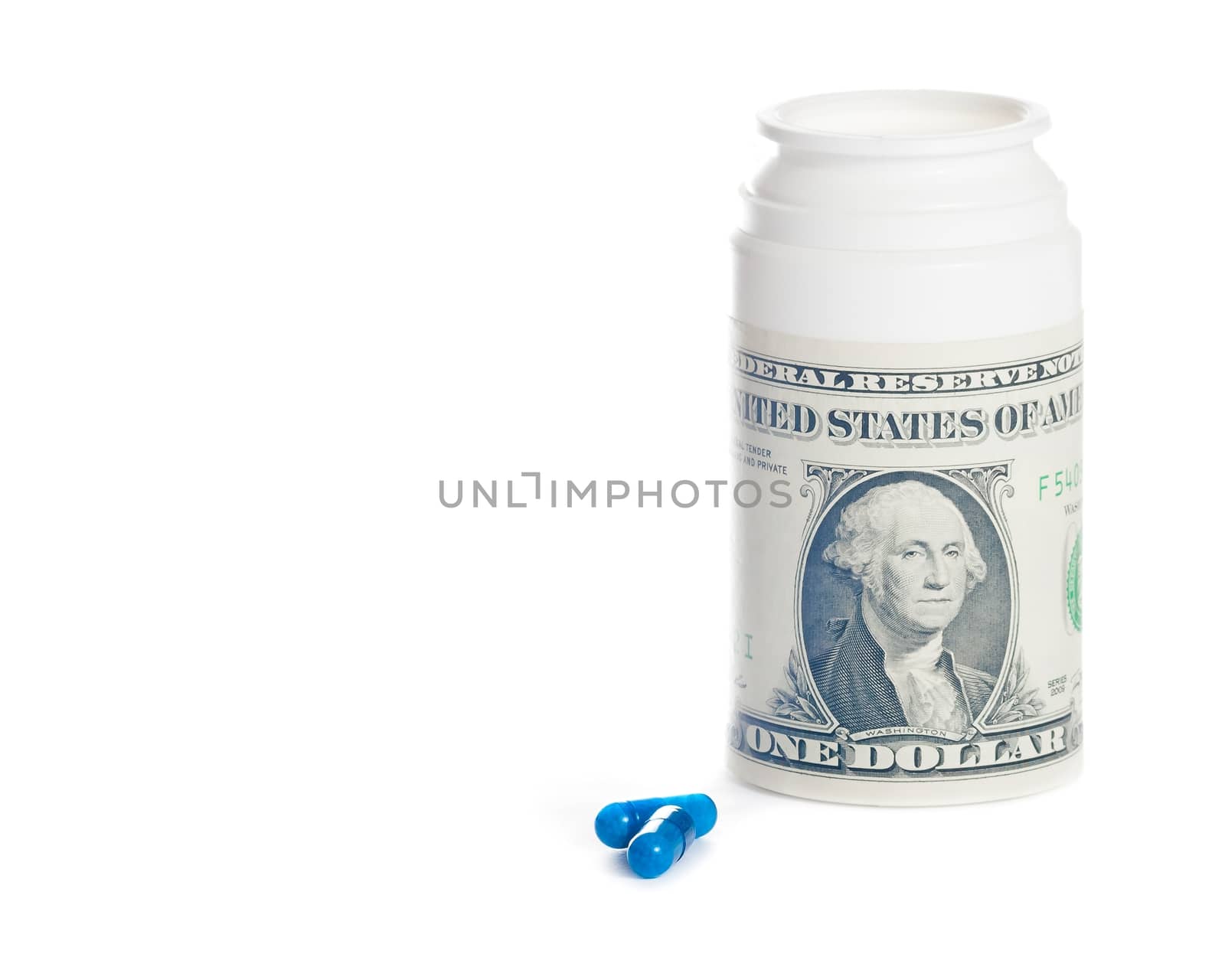 pills near dollar on pills container under white background with space for text, cost of medical health care