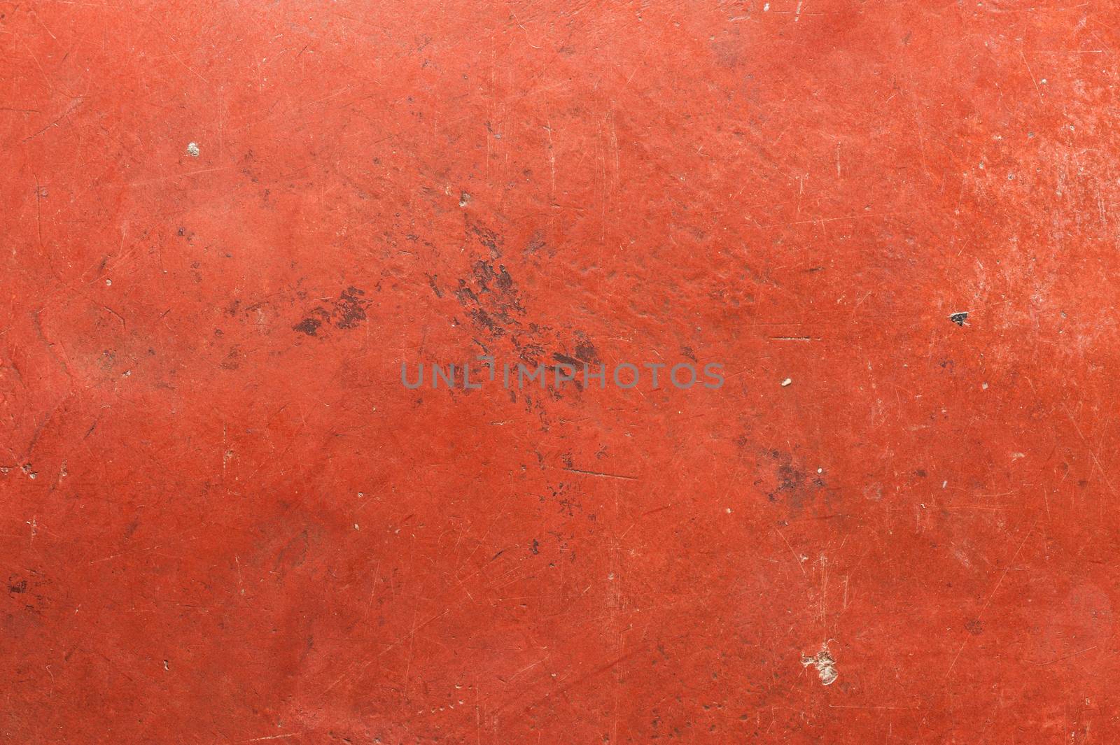 Old red cement wall with scratch