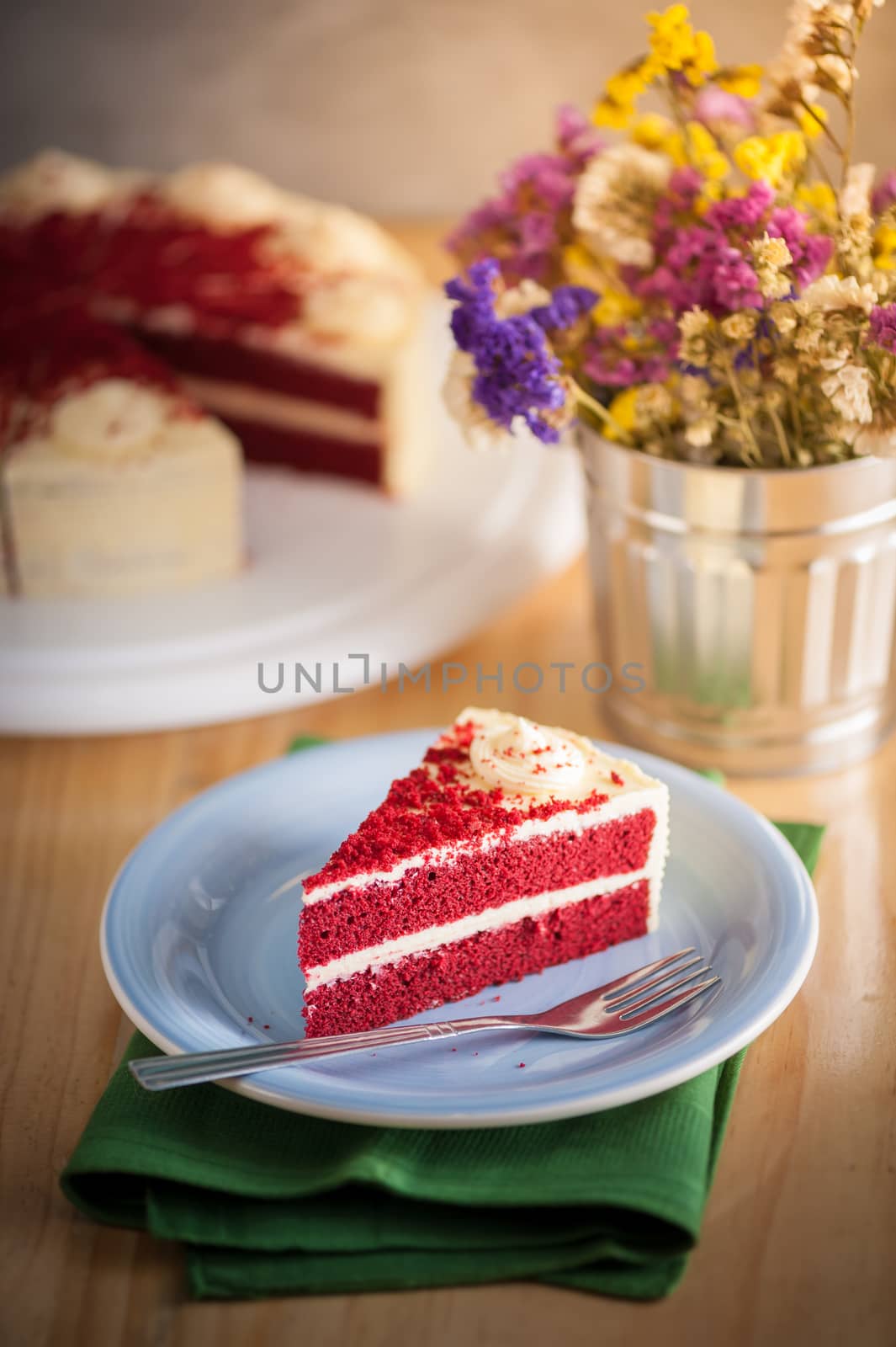 Red velvet cake on wood table with morning scene