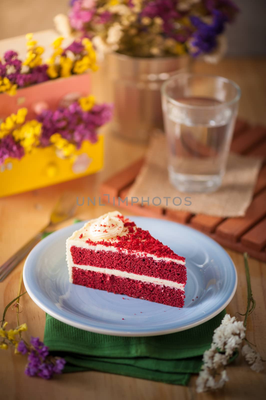 Red velvet cake on wood table with morning scene