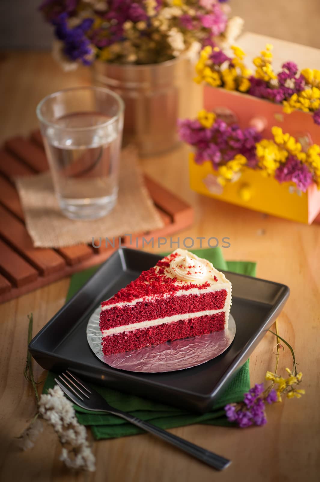 Red velvet cake on wood table with morning scene