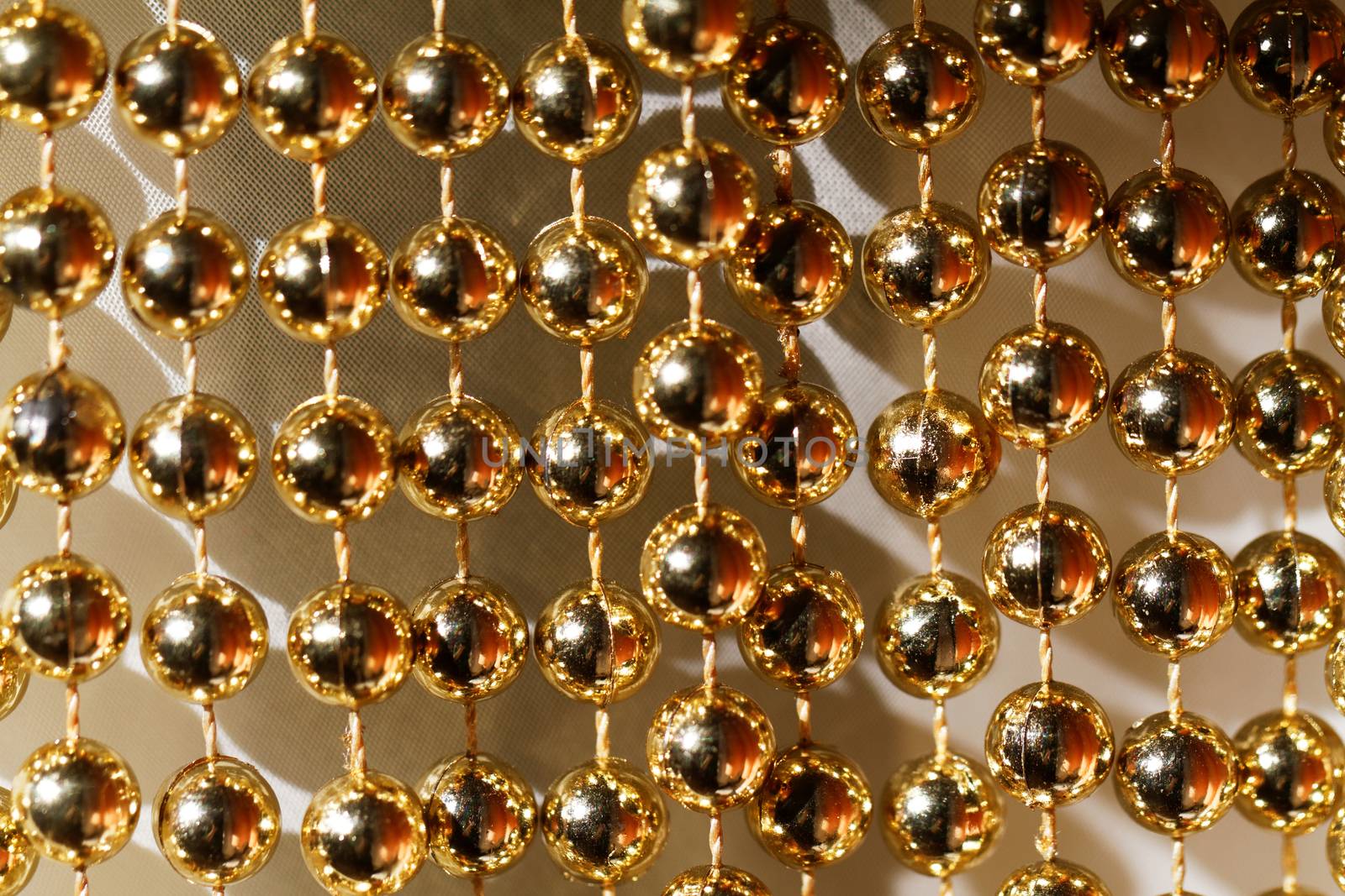 Photo of shining golden beaded garland decor