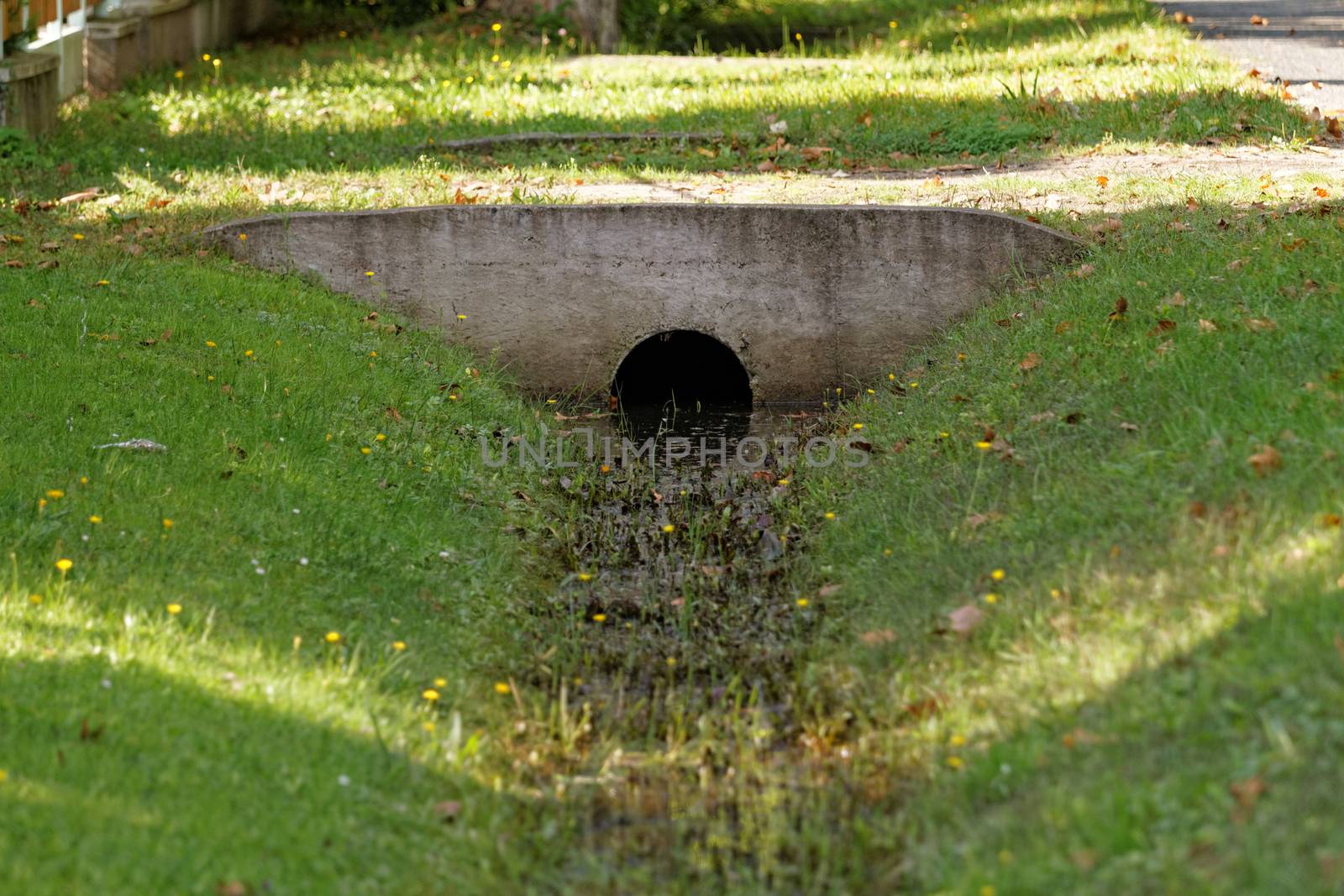 Ditch through with water in the village 