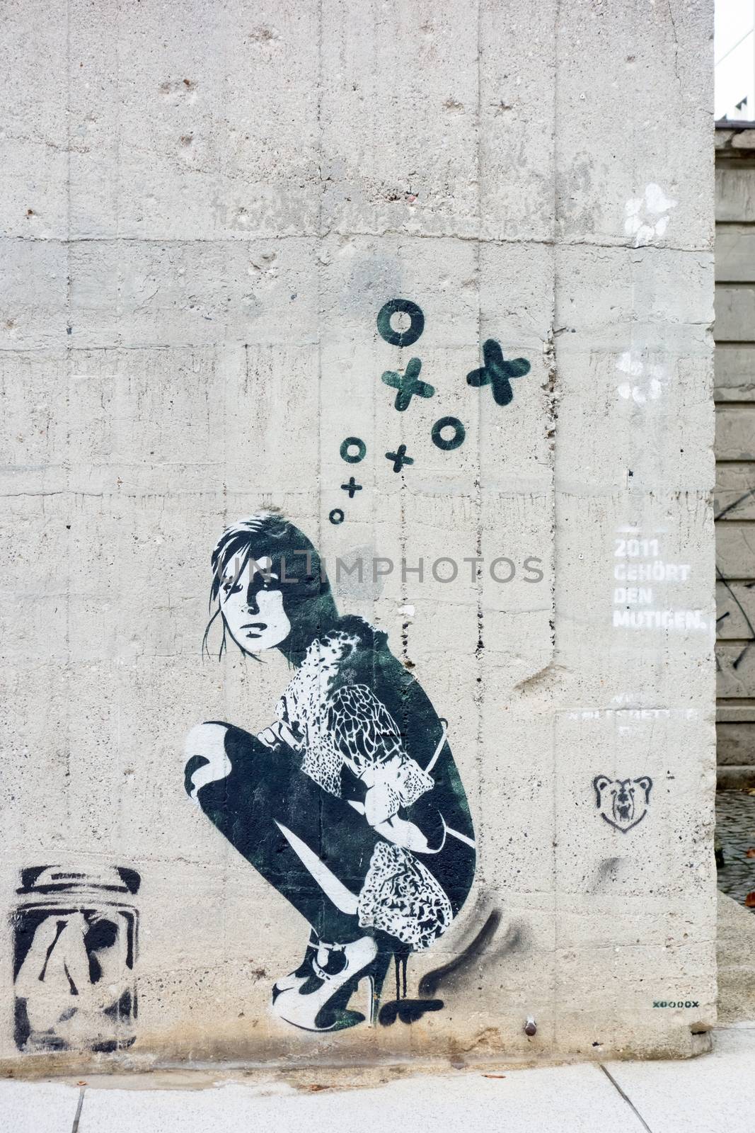 Berlin, Germany - October 26, 2013: Graffiti of a girl / woman on a concrete wall in Berlin.