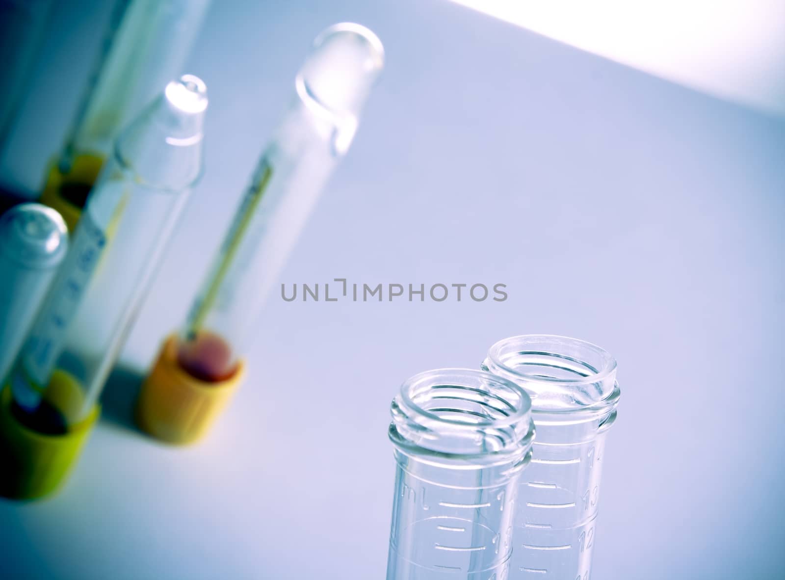 detail of test tubes in hospital laboratory on table with space for text