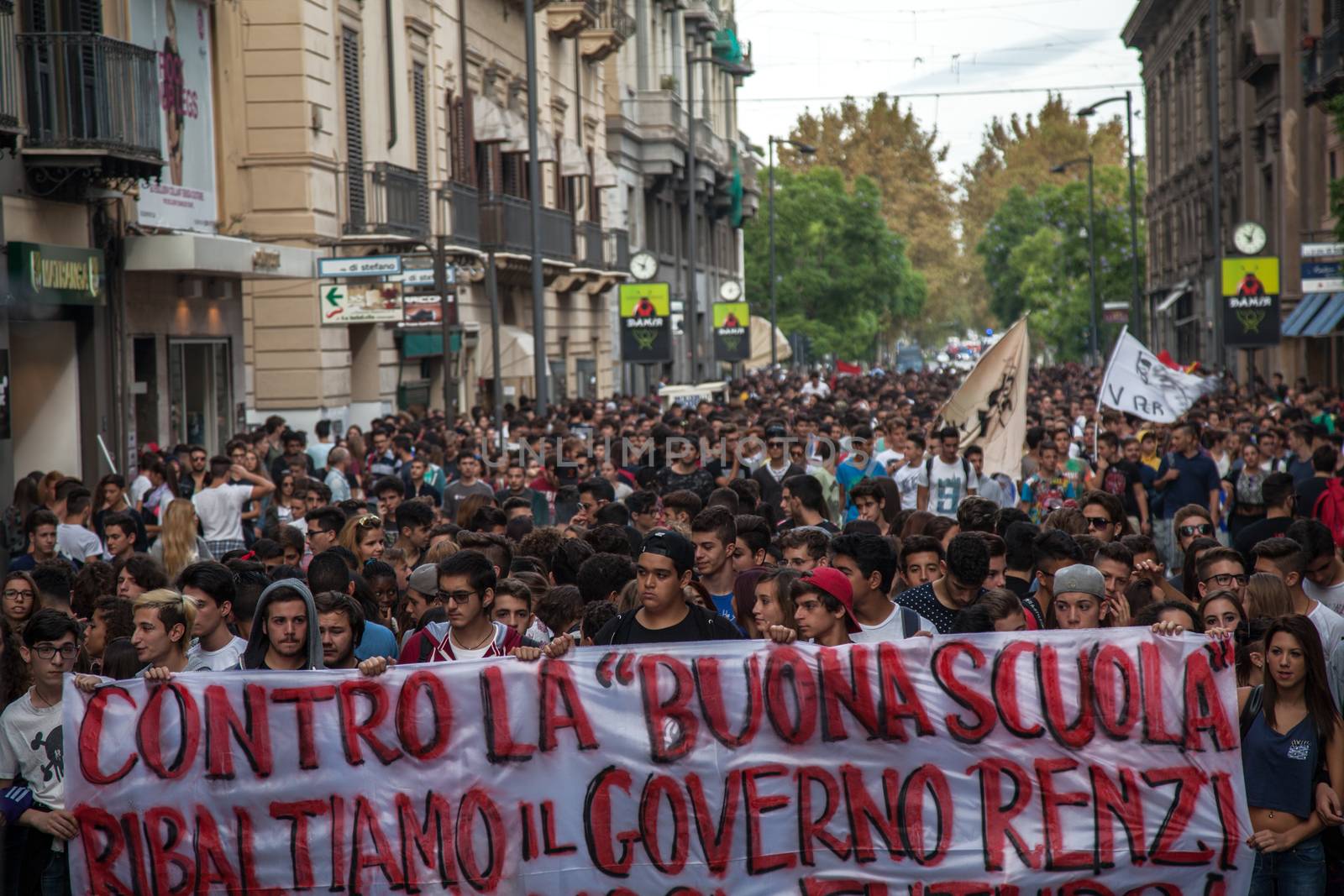 ITALY, Palermo: Thousands of students marched and held banners against Renzi's school reform in Palermo, Italy on October 9, 2015.A theme of the protests is the revisions to the calculation of family income, which some say will reduce scholarships and housing for students. Students throughout the country protested what's know as La Buona Scuola.  A spokesman for the protesters said they were going to announce a week of mobilization lasting until October 17. They plan to launch an attack for free education and reversal of policies. 