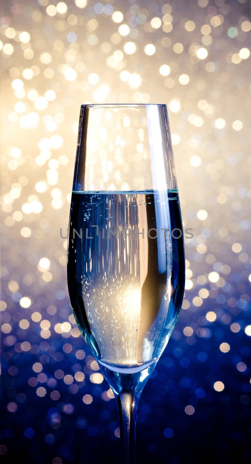 one flute of champagne on abstract background by donfiore