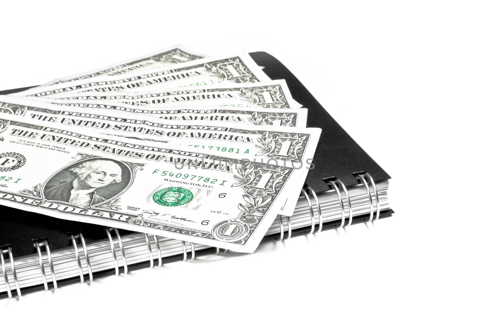 dollars on notebook, financial concept by donfiore