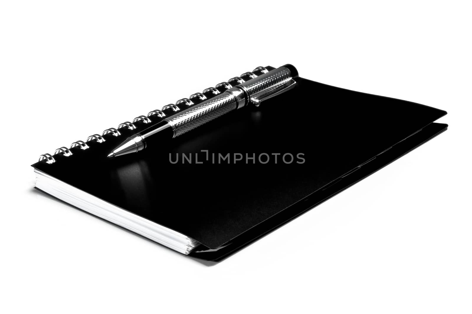 black notebook and pen by donfiore