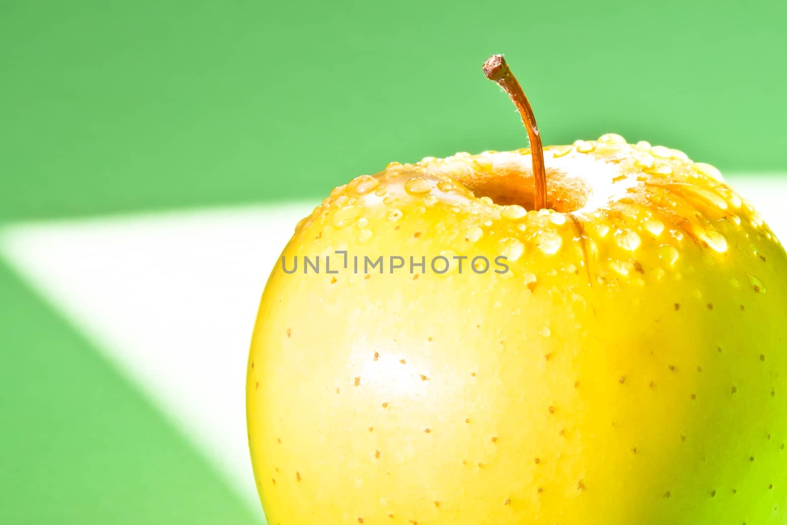 detail of apple with space for text on multicolor background