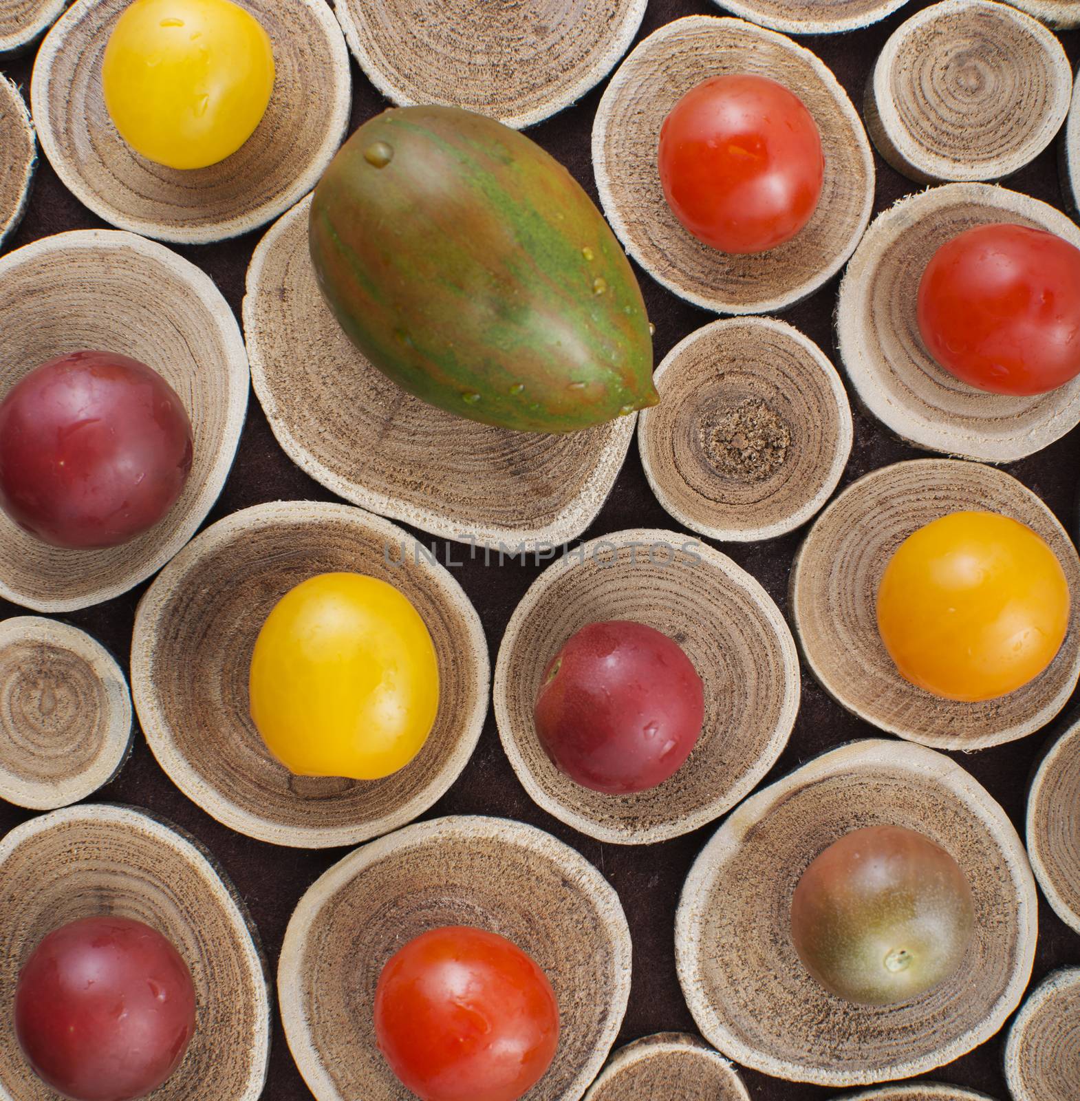 Colorful cherry tomatoes on wood by rgbspace