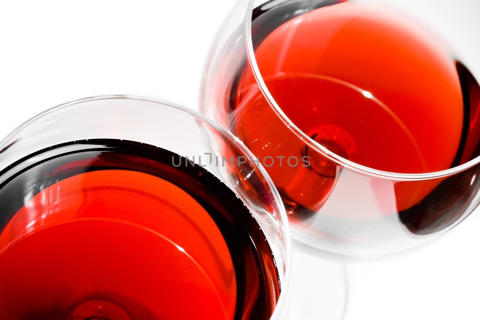 top of view of two red wine glasses on white background