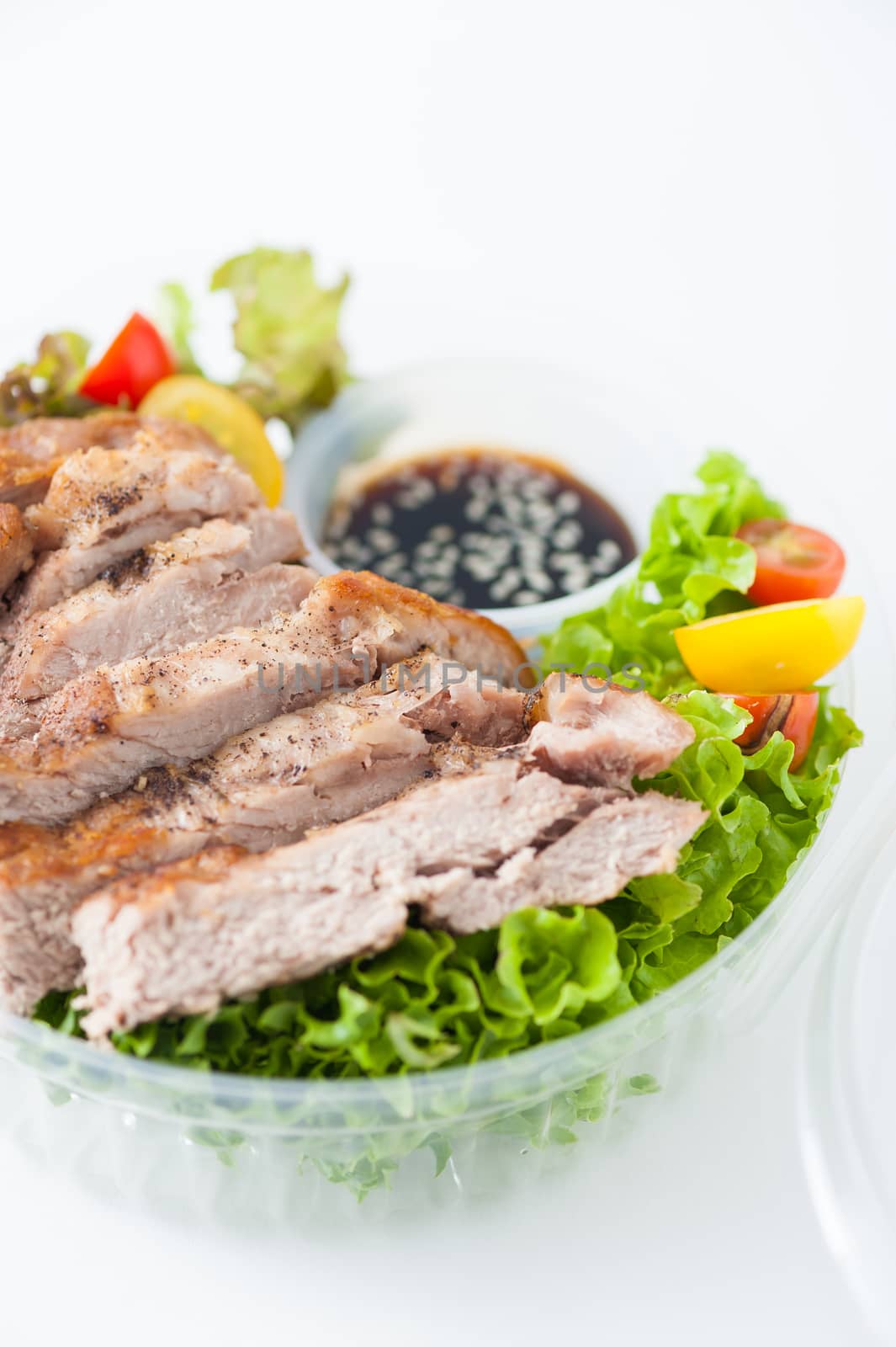 Grilled pork and teriyaki sauce (Japanese sweet sauce) cooked by clean food concept with salad in lunch box