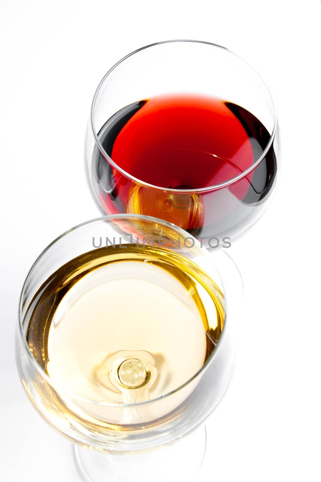 top of view of red and white wine glasses on white background