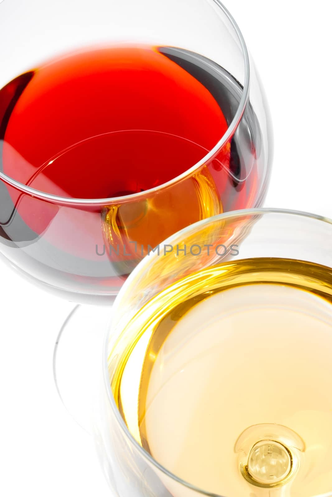 close-up of red and white wine glasses on white table