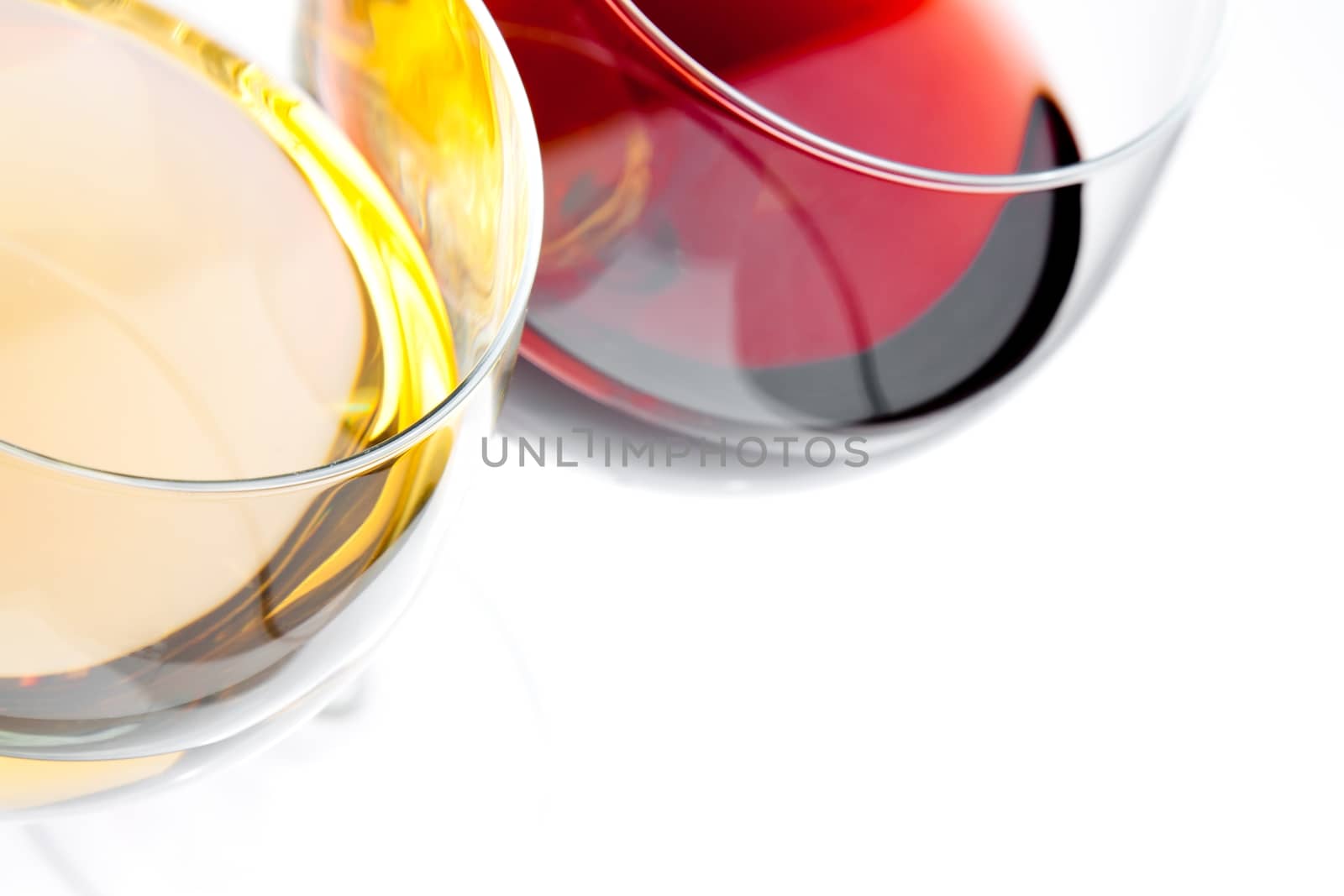 top of view of red and white wine glasses with space for text on white background