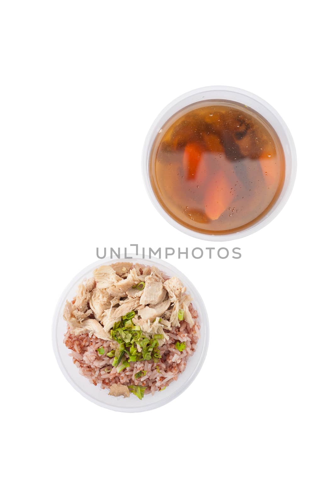 Brown rice gruel with chicken breast with vegetables soup cooked by clean food concept in separate lunch box isolated on white background