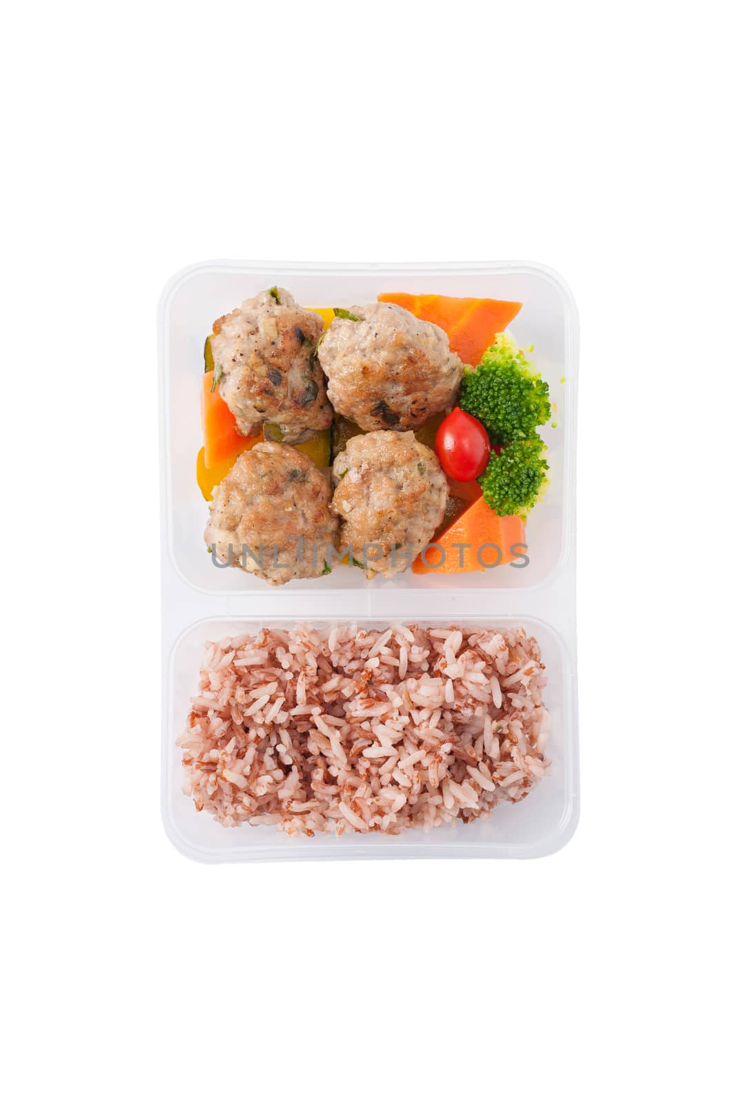 Thai style fried pork ball cooked by clean food concept with vegetables and brown rice in lunch box isolated on white background