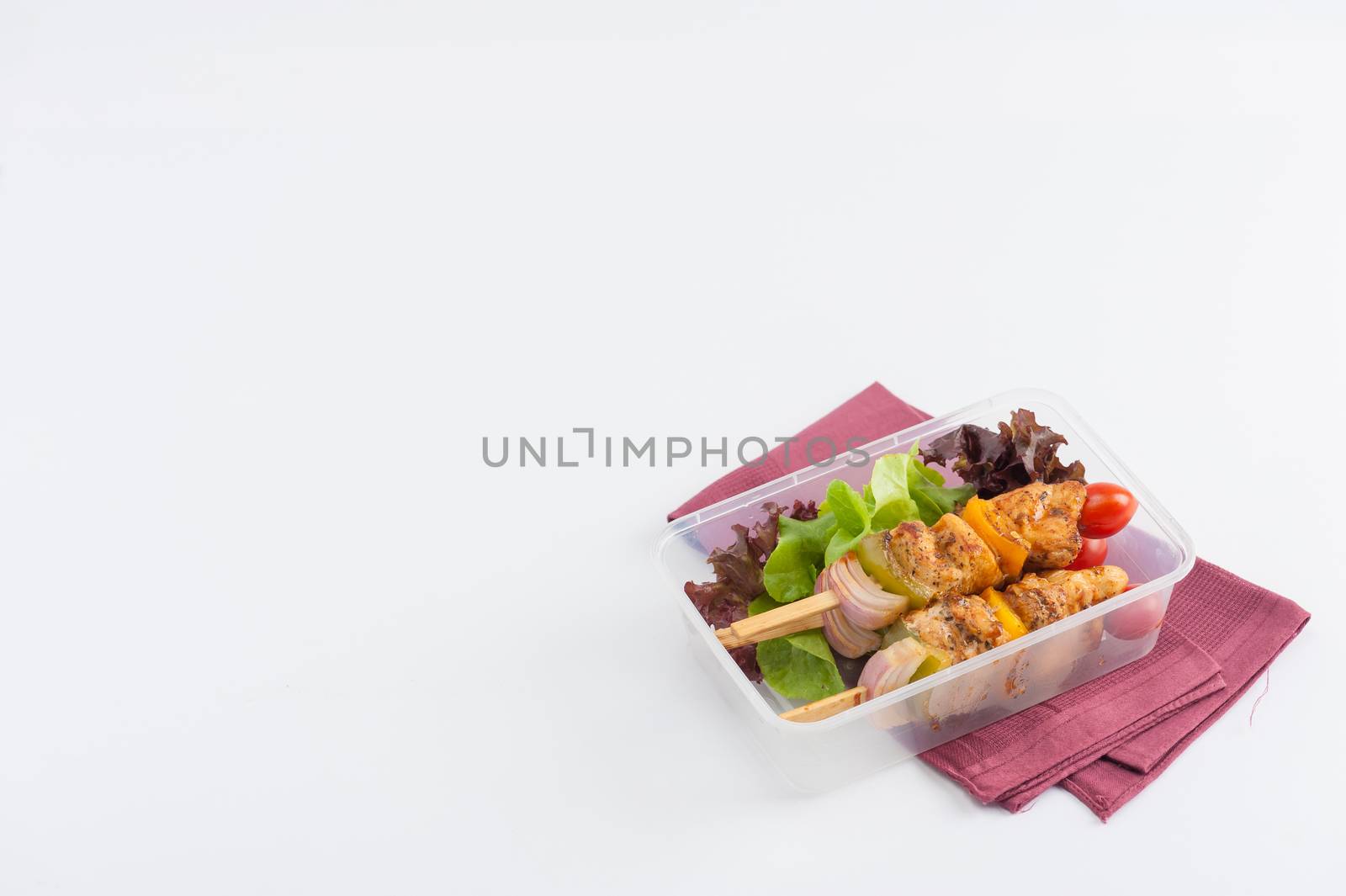 Chicken breast barbecue cooked by clean food concept and vegetables in lunch box on white table