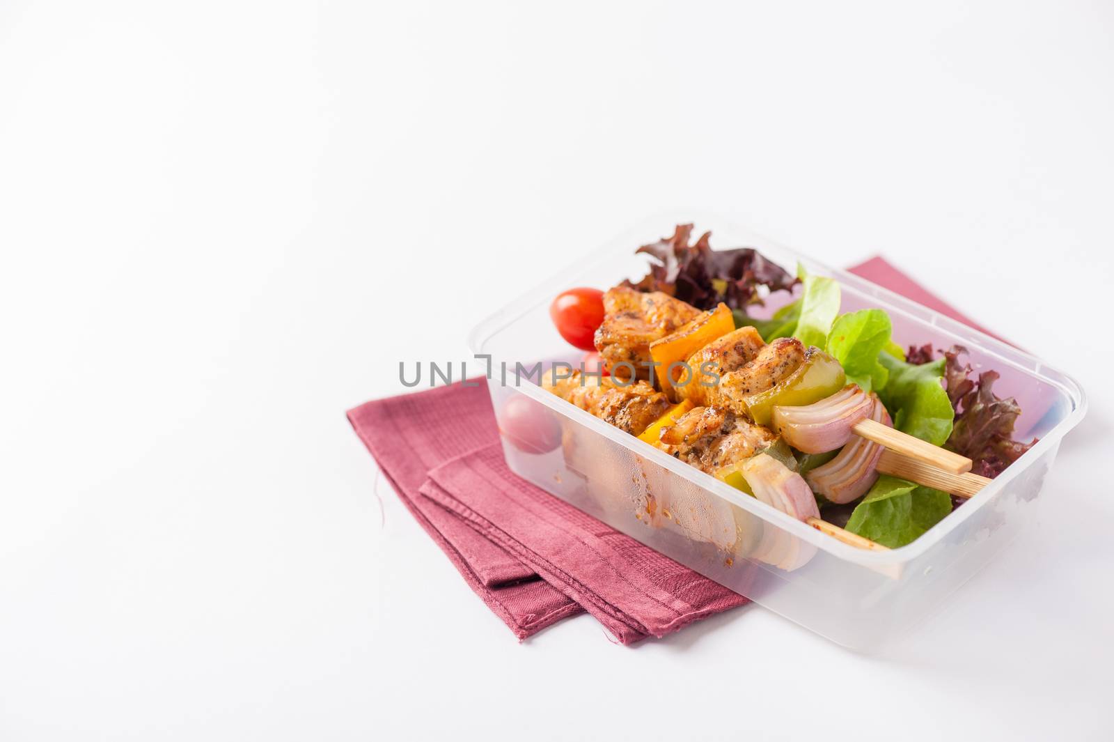 Chicken breast barbecue cooked by clean food concept and vegetables in lunch box on white table