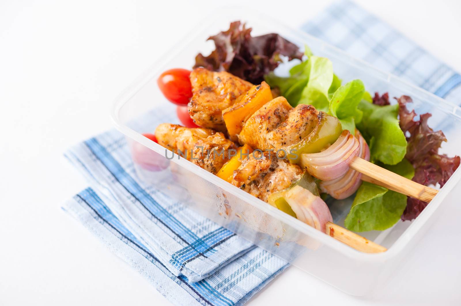 Chicken breast barbecue cooked by clean food concept and vegetables in lunch box on white table
