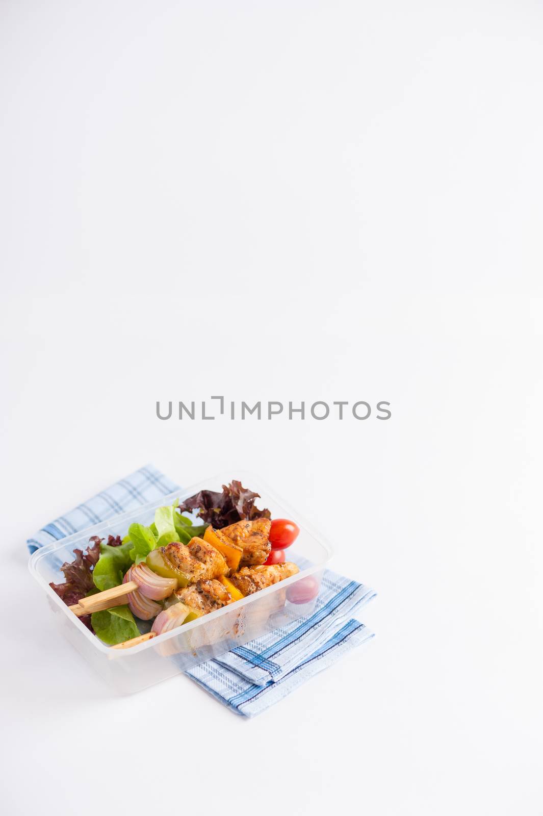 Chicken breast barbecue cooked by clean food concept and vegetables in lunch box on white table