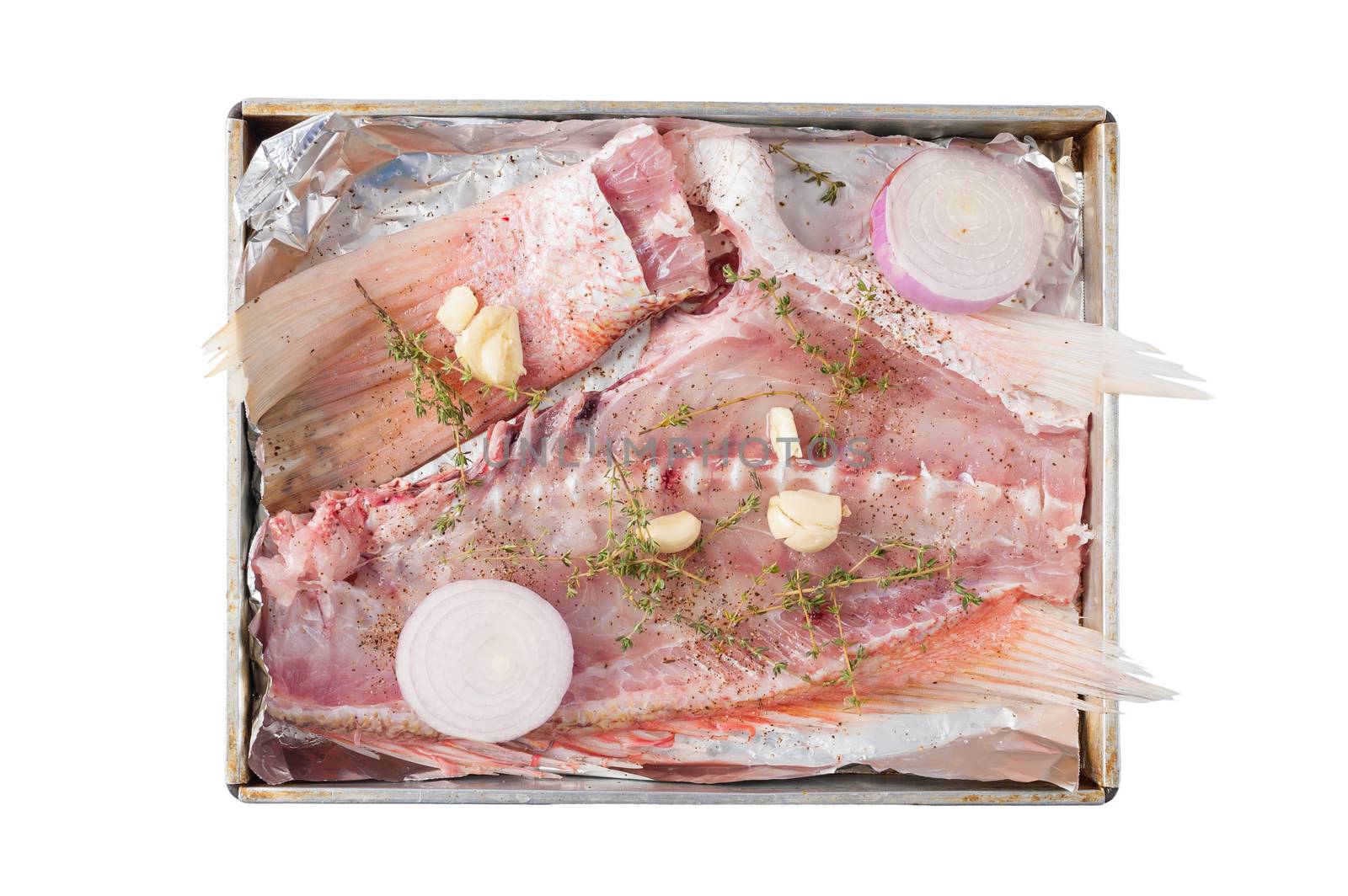Ingredients for making fish stock soup in steel tray isolated on white background