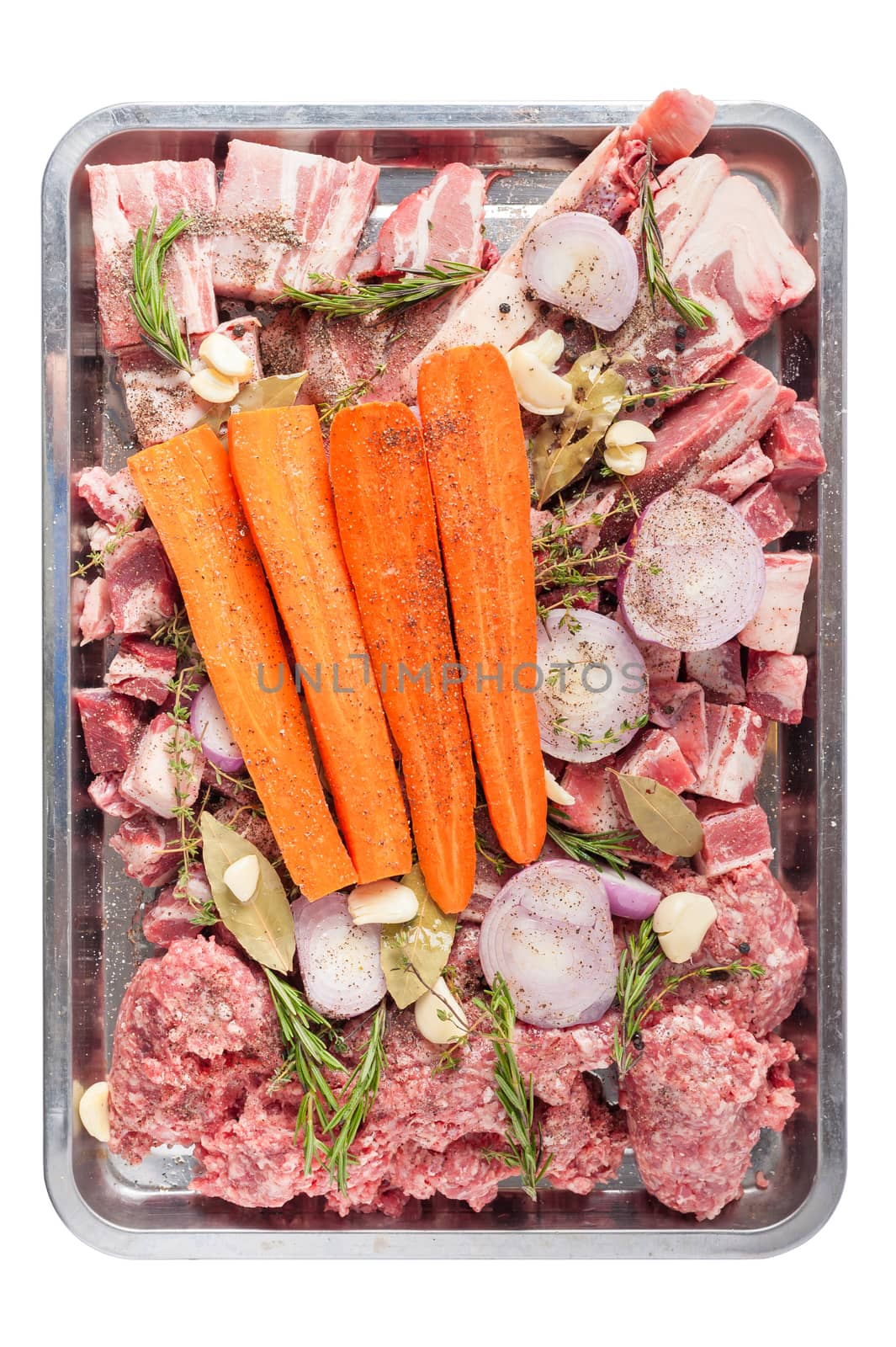 Ingredients for making pork stock soup in steel tray isolated on white background