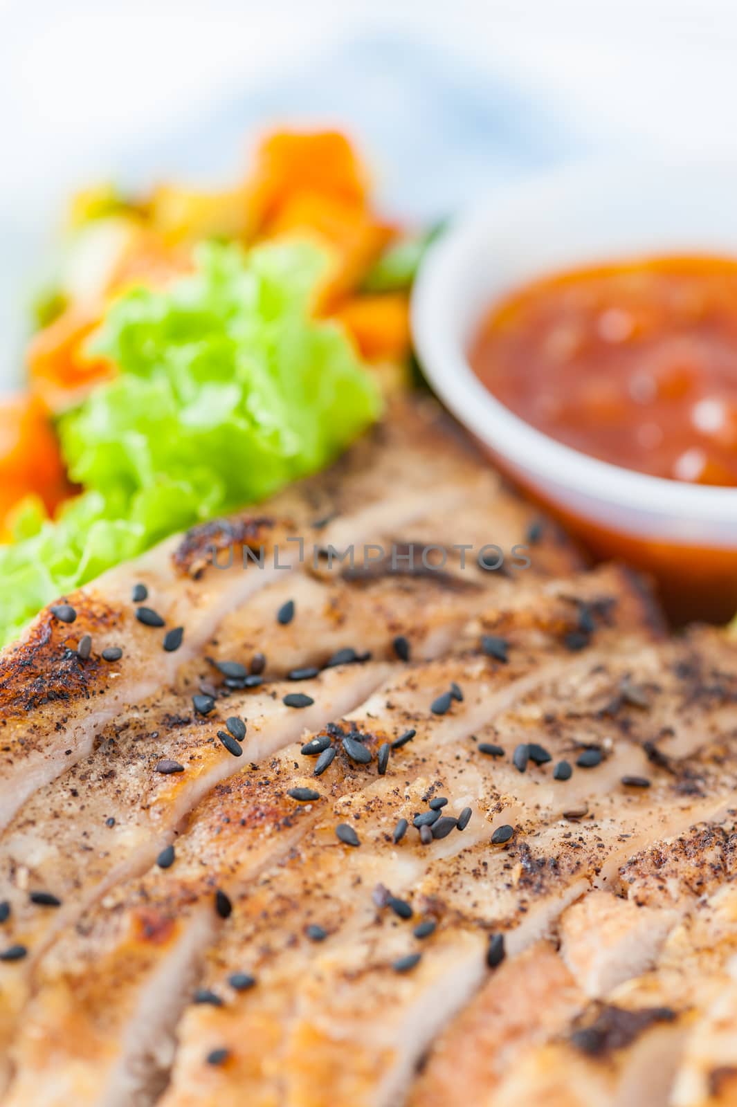 Roasted pork with three flavoured (sweet, sour, spicy) sauce cooked by clean food concept with vegetables in lunch box