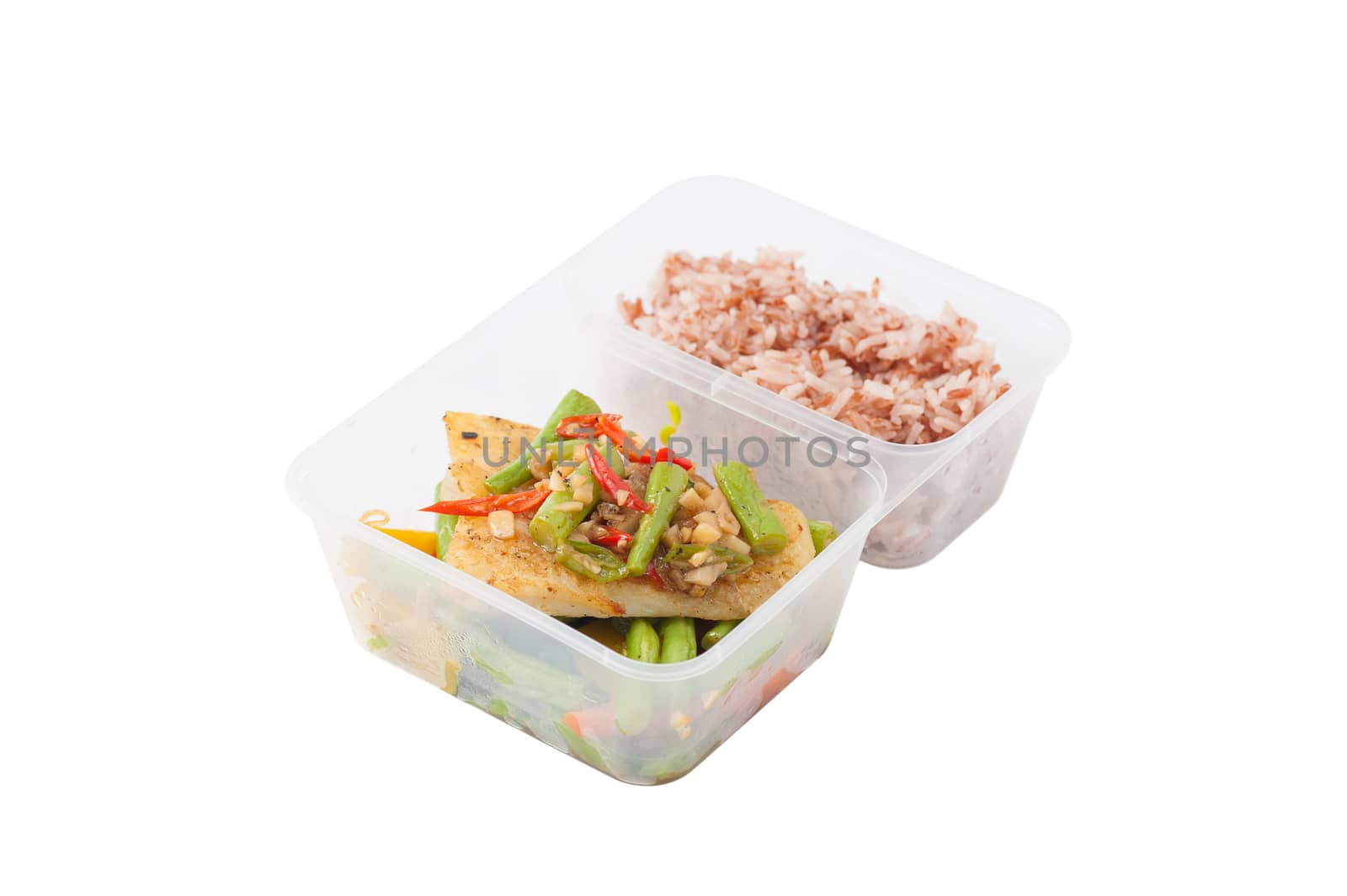 Pangasius fish fried with chili and vegetables cooked by clean food concept with brown rice in lunch box on white table