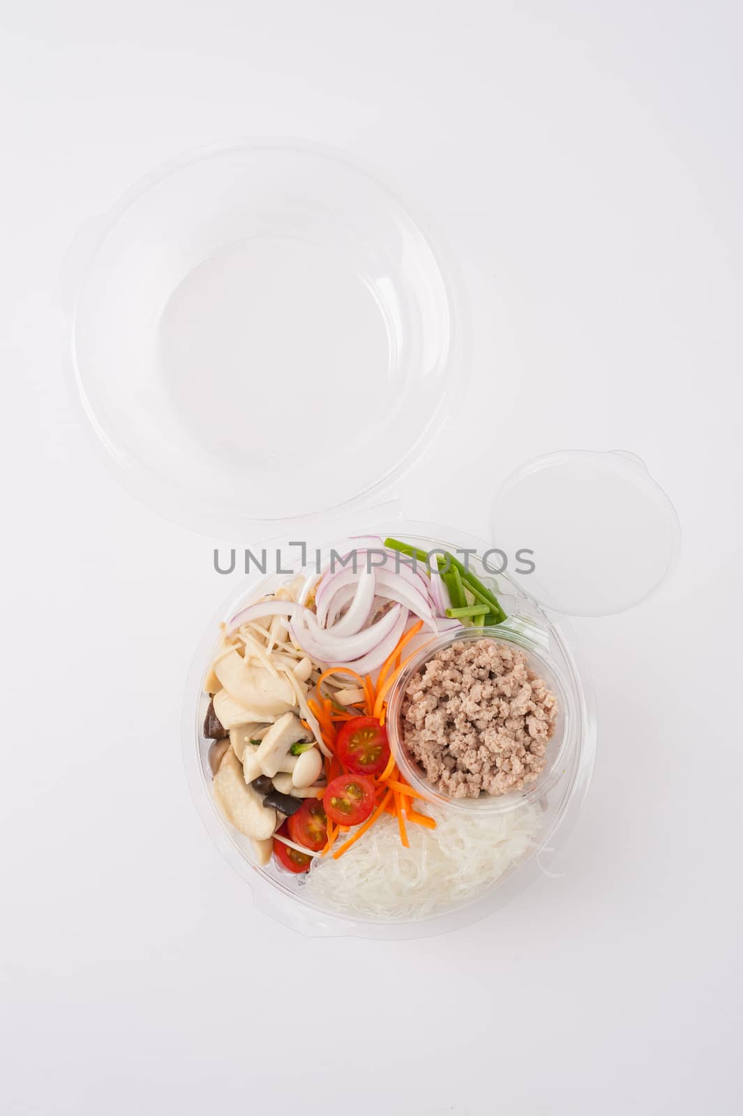 Thai spicy salad with minced pork, mushroom, vegetables and vermicelli cooked by clean food concept on white table