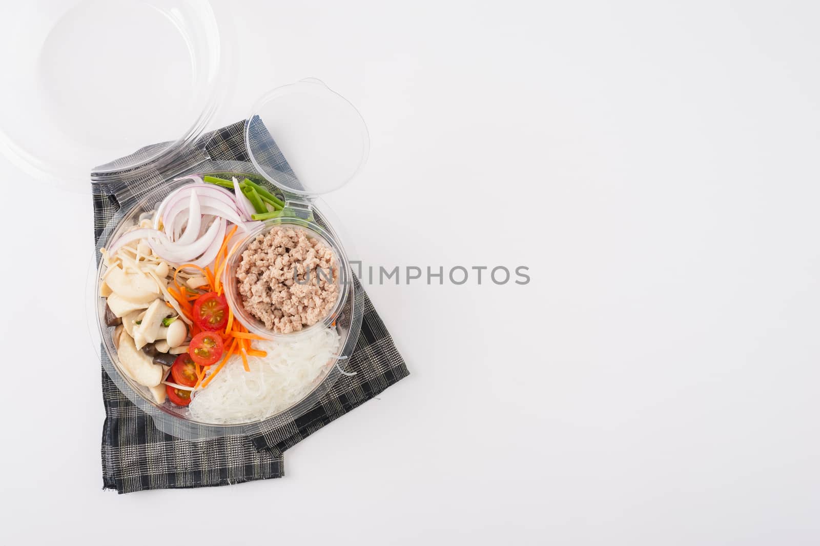 Thai spicy salad with minced pork, mushroom, vegetables and vermicelli cooked by clean food concept on white table