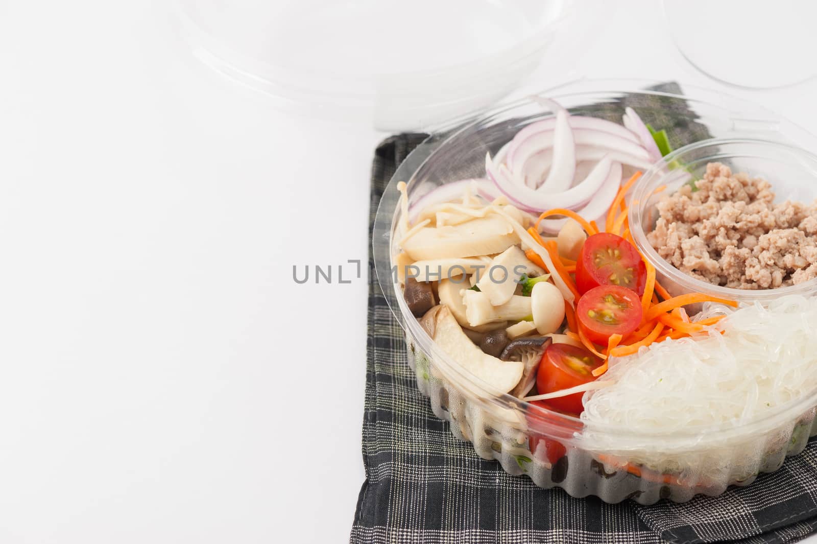 Thai spicy salad with minced pork, mushroom, vegetables and vermicelli cooked by clean food concept on white table