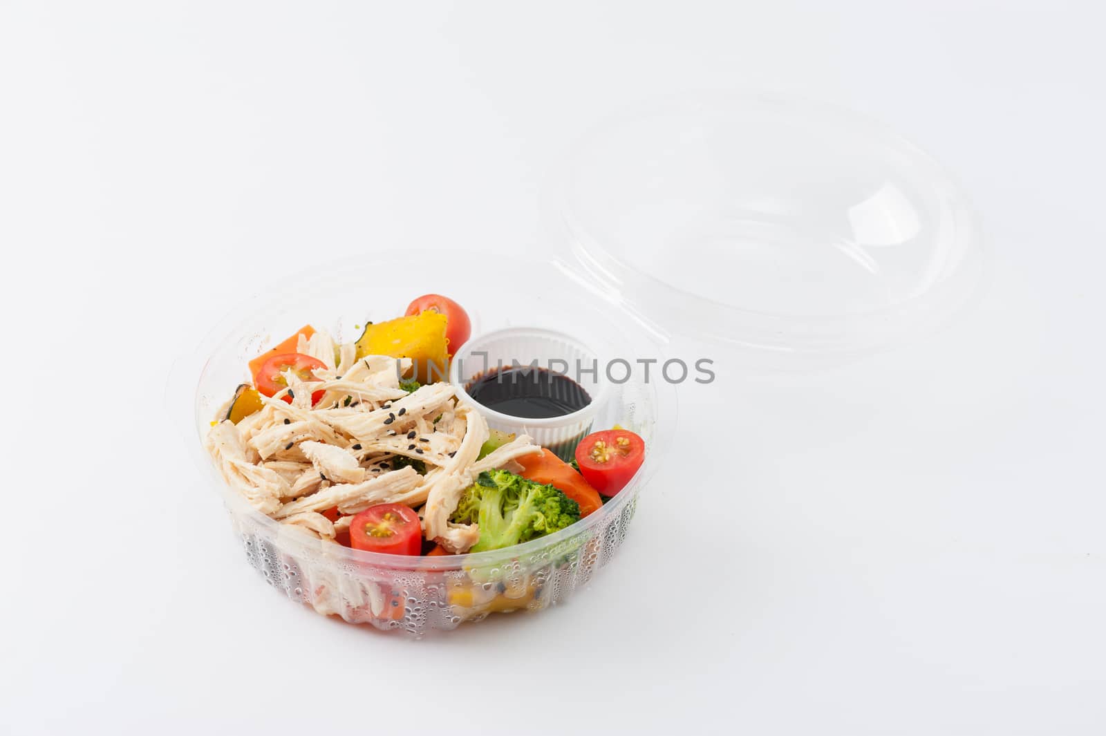 Salad soba with vegetables and shred chicken cooked by clean food concept in lunch box on white table