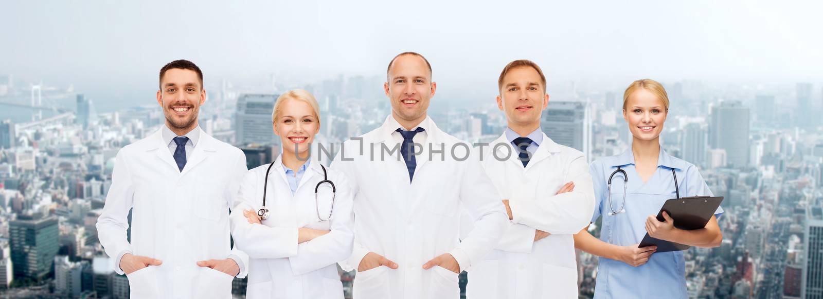 group of doctors with stethoscopes and clipboard by dolgachov