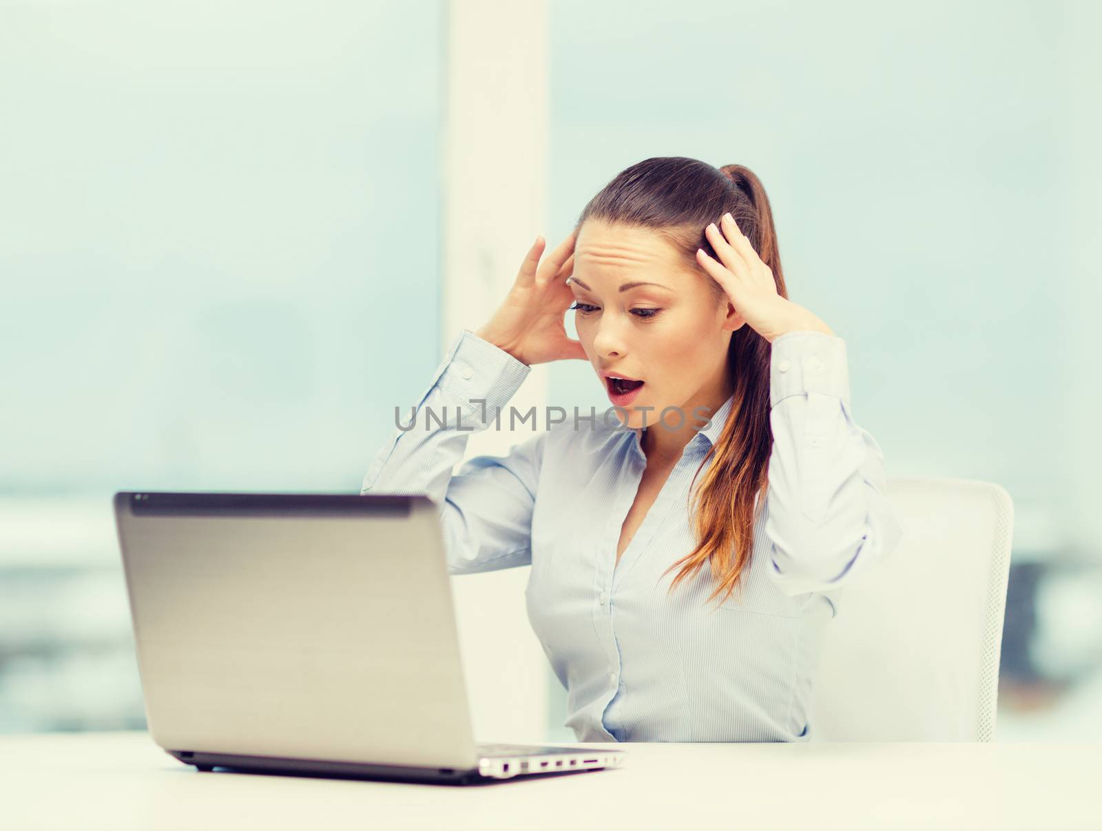 business, office and technology concept - stressed businesswoman with laptop at work