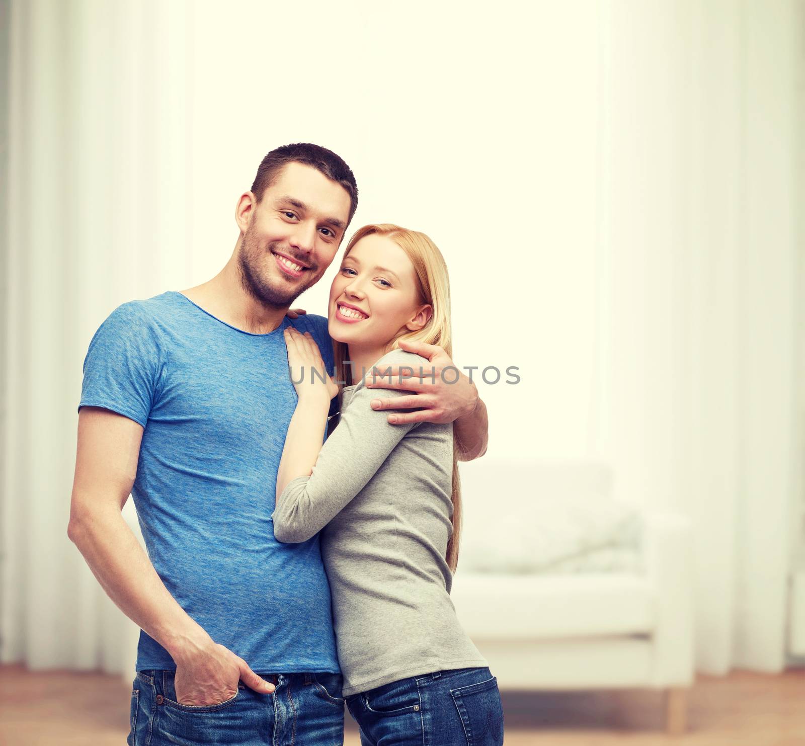 love and family concept - smiling couple hugging