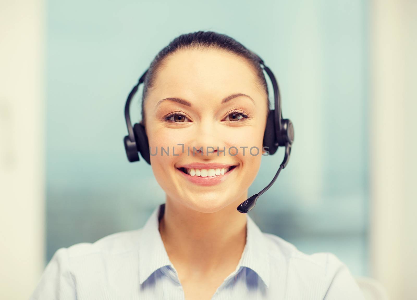 female helpline operator with headphones by dolgachov