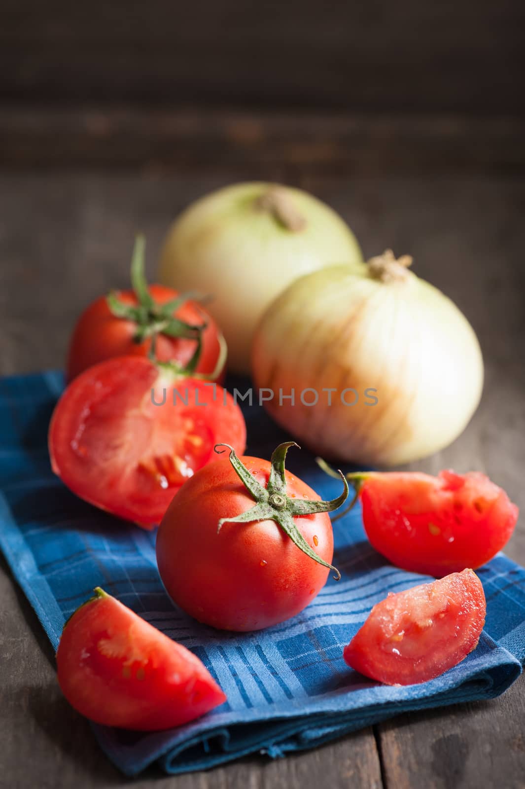Vegetables on wood table with low key scene