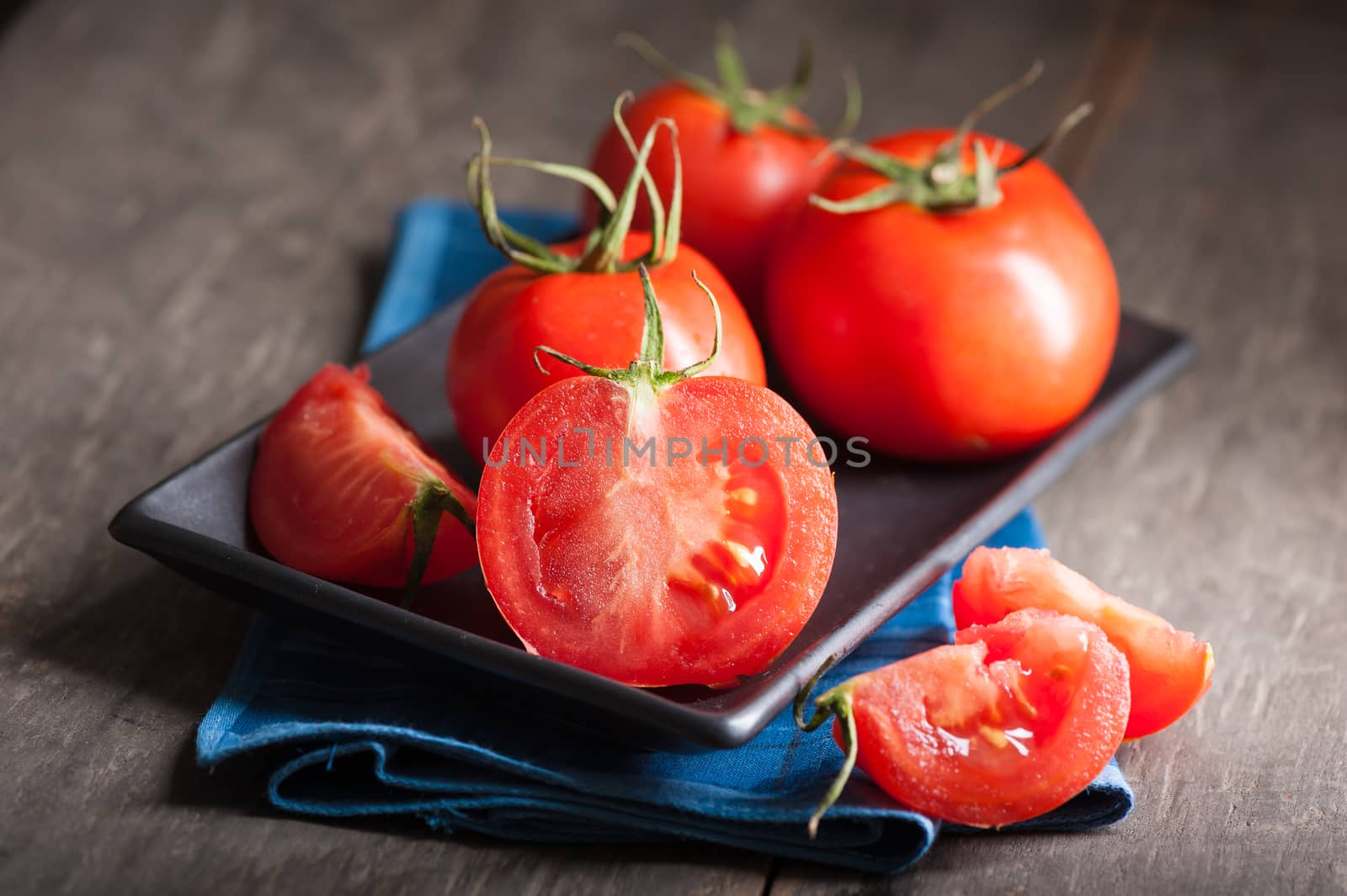 Vegetables on wood table with low key scene