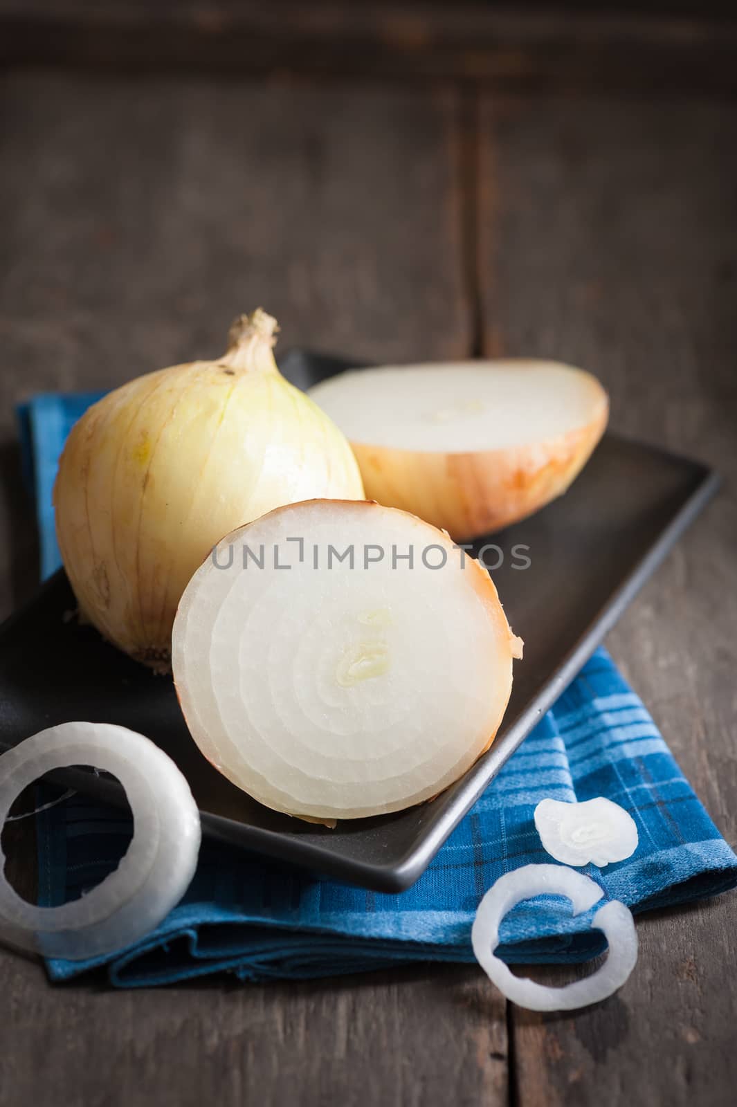 Vegetables on wood table with low key scene