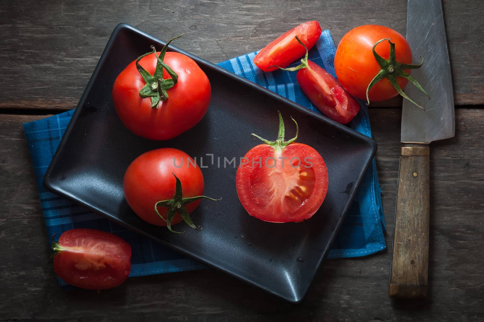 Vegetables on wood table with low key scene